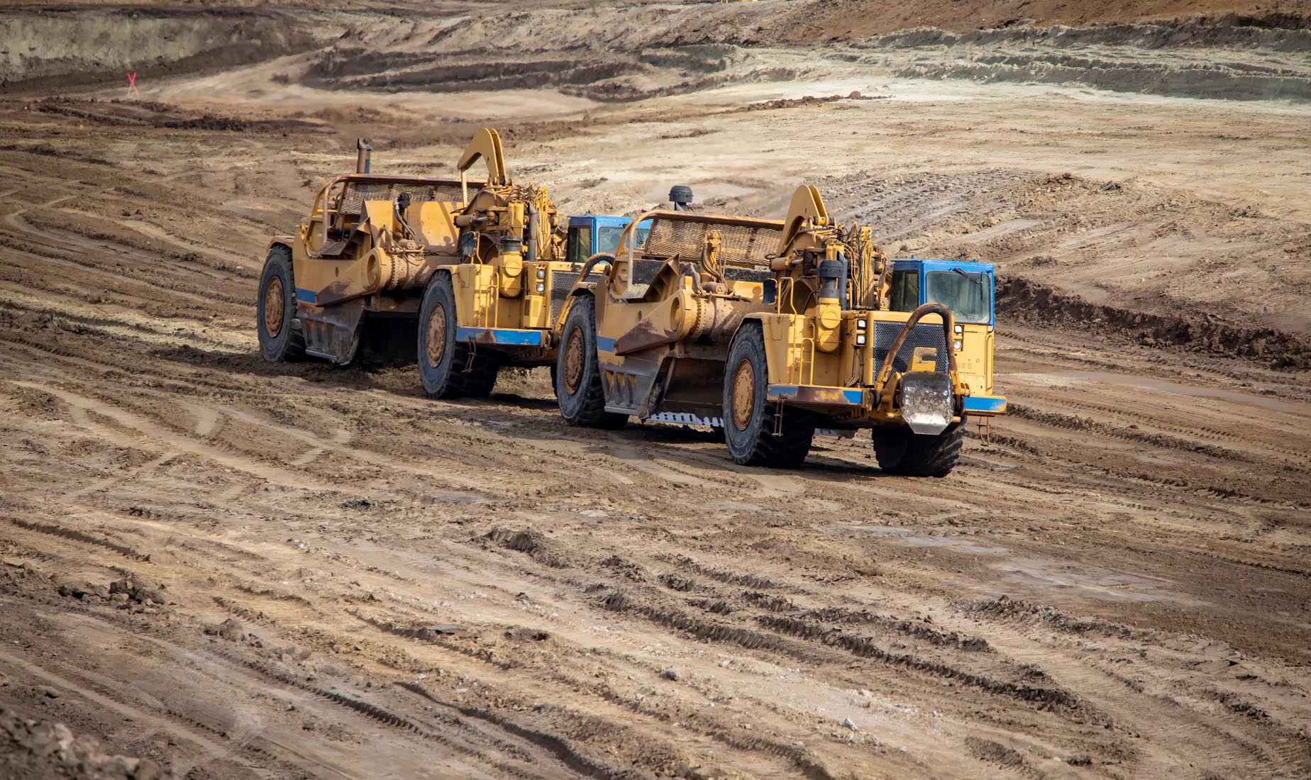 Heavy Earthmoving Equipment Including Scapers And Motor Graders