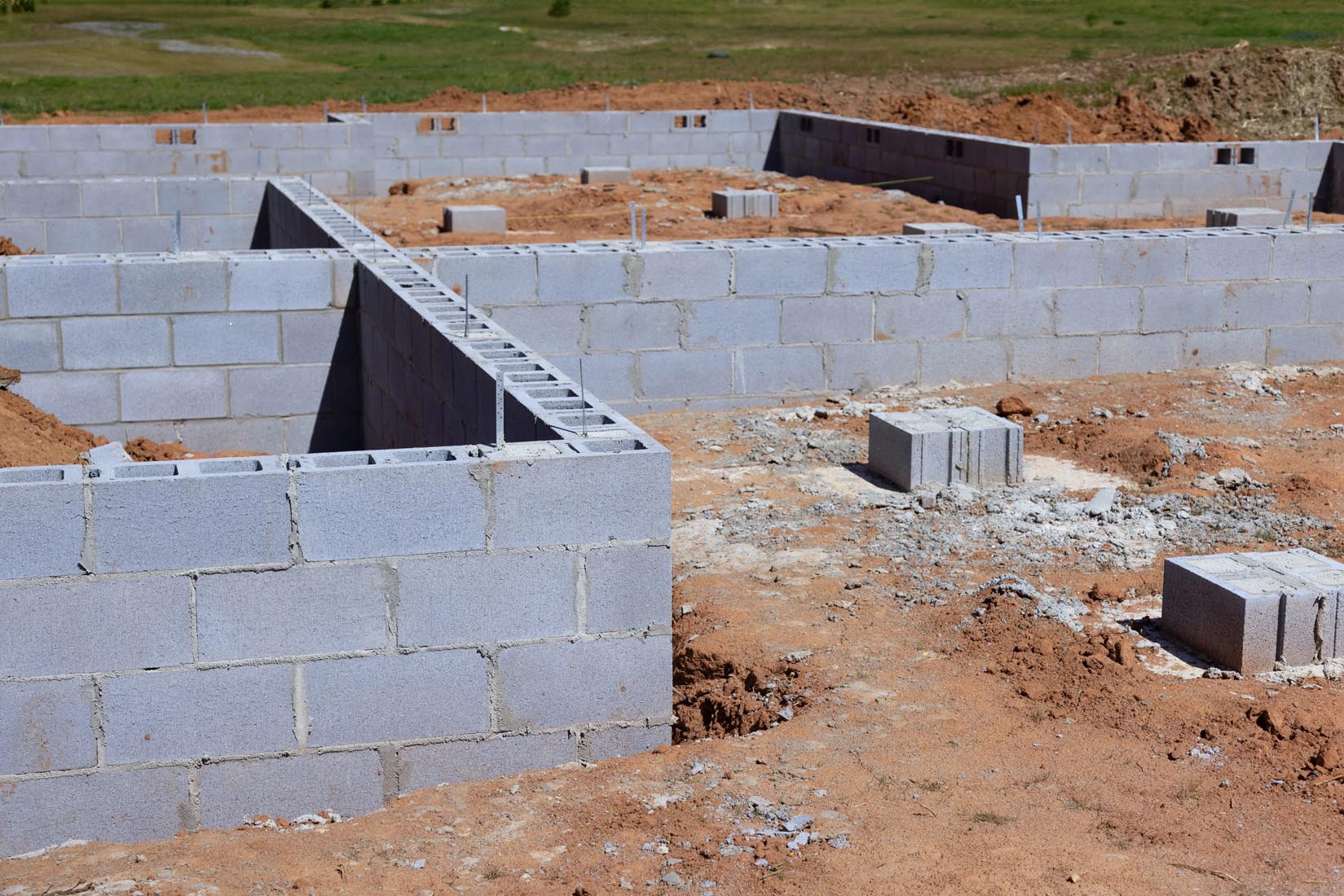 At A Construction Site, Cement Blocks Support Foundation For Wall Of House
